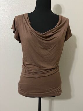 Bebe brown vintage jersey top with lace back. Size M. Pre-Owned Condition-Good.